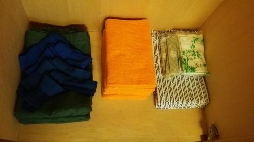 a group of towels sitting on top of a table at Hakuba Hotel Hana-no-Sato in Hakuba