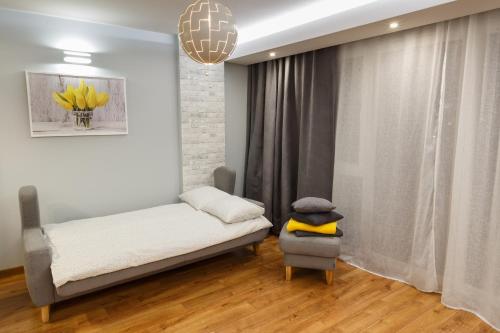 Ένα ή περισσότερα κρεβάτια σε δωμάτιο στο Apartament Jurajska Plaza, prywatne miejsce parkingowe , Targi