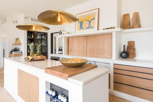 a kitchen with a bowl on a cutting board on a counter at Boutique Hotel Villa Gala by Fimedhotels in Cadaqués