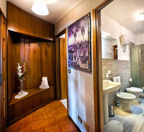 a bathroom with a toilet and a sink at Villalbert in Castel Gandolfo