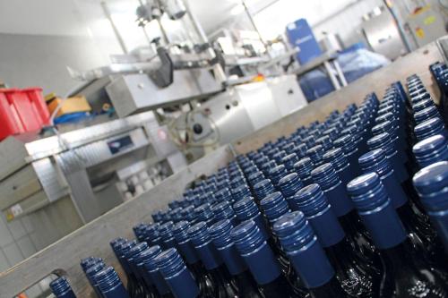 a bunch of blue vases are being made in a factory at Weingut-Gästezimmer Pongratz in Gamlitz