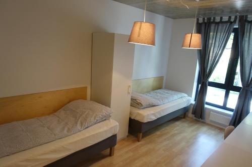 מיטה או מיטות בחדר ב-Raua 15 Apartment