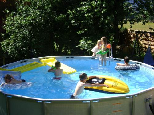 a group of people in a swimming pool at Apartmenthaus Hinterer in Bad Goisern