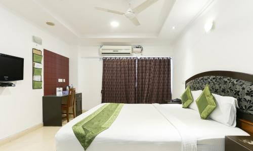 Ένα ή περισσότερα κρεβάτια σε δωμάτιο στο Laavish 7 Hotel