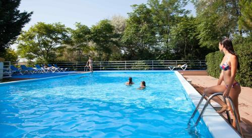 a group of people in a swimming pool at Hotel Valdor in Cavallino-Treporti