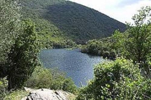 a lake in the middle of a mountain at B&B Gassa d'Amante in Capoterra