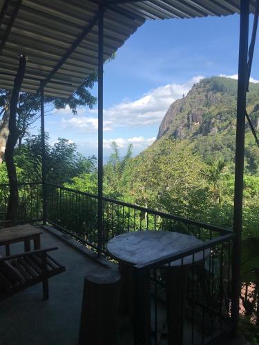 a porch with a view of a mountain at Country Homes in Ella