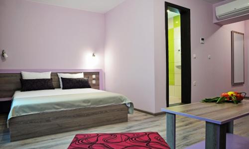 Katil atau katil-katil dalam bilik di Visito Aparthouse