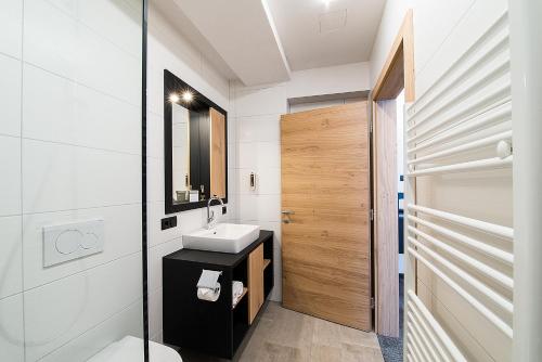 Ванная комната в Arthur's Hotel und Apartments am Achensee