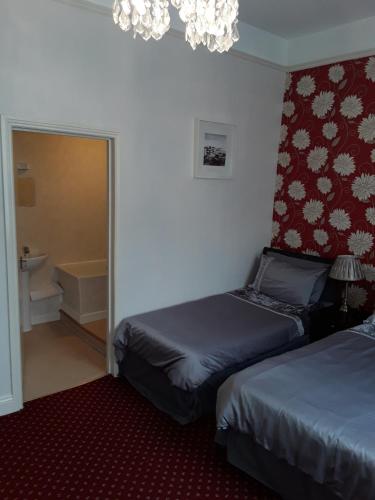 Postel nebo postele na pokoji v ubytování Langport Arms Hotel