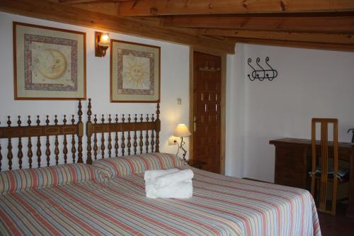 Postel nebo postele na pokoji v ubytování Cortijo del Sidi