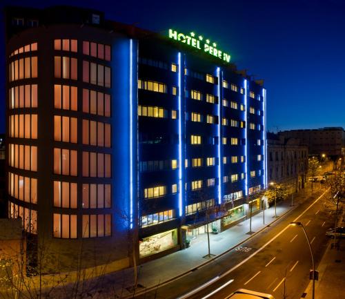 a night view of a hotel with a sign on it at Sallés Hotel Pere IV in Barcelona