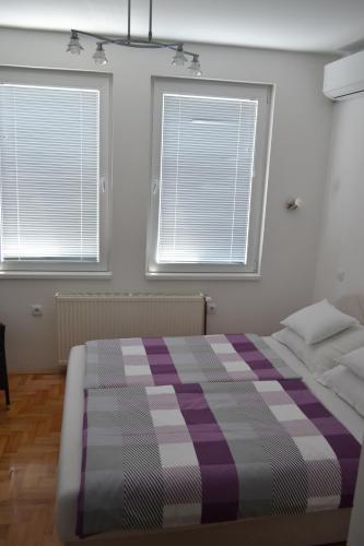 Una cama o camas en una habitación de Apartment Harmony