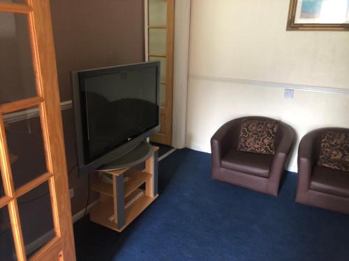 チャードゲストハウスにあるテレビまたはエンターテインメントセンター