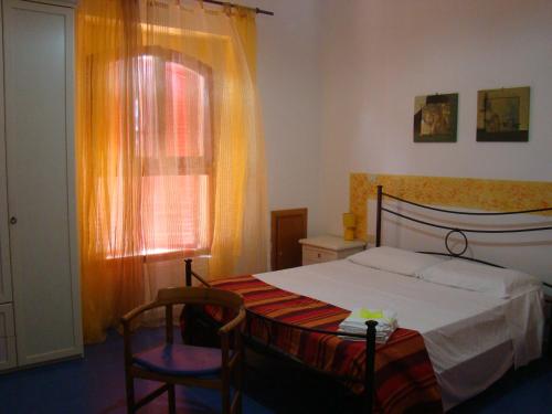 Ein Bett oder Betten in einem Zimmer der Unterkunft Casa Vacanze Guardamare