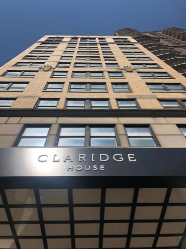 a building with a clock on the side of it at Claridge House in Chicago