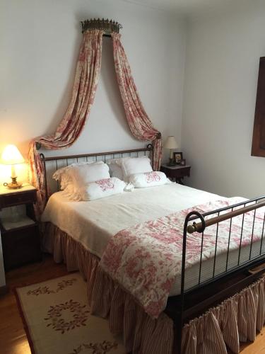 a bedroom with a bed with a canopy at Quinta de Santa Maria do Dao in Santa Comba Dão