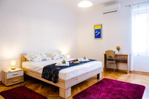 Posteľ alebo postele v izbe v ubytovaní Dundo Baldo Apartment