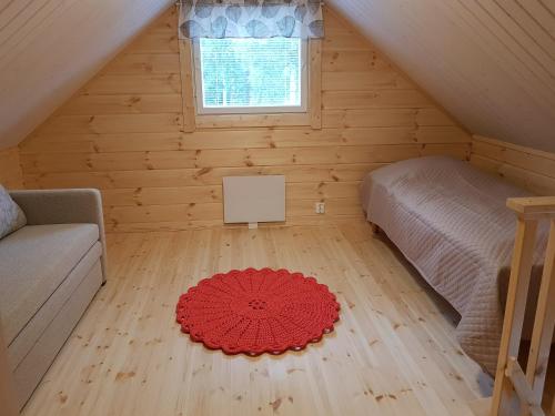 Voodi või voodid majutusasutuse Mansikkaharju Holiday Camp toas