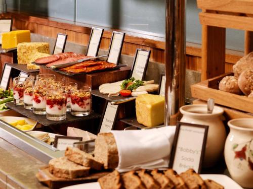 a buffet with different types of food on display at Hotel City Kutaisi in Kutaisi