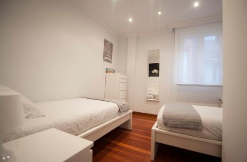 A bed or beds in a room at Calle Río de la Pila