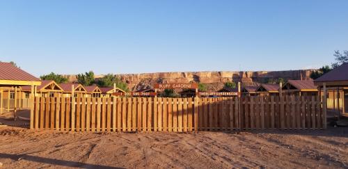 a wooden fence in front of a building at Bluff Gardens in Bluff