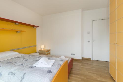 a bedroom with a bed with towels on it at Prestige Apartments by Quokka 360 - spacious flats with terraces in Lugano