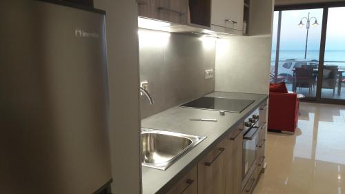 Kuchyň nebo kuchyňský kout v ubytování Casa Bella Deluxe Apartments