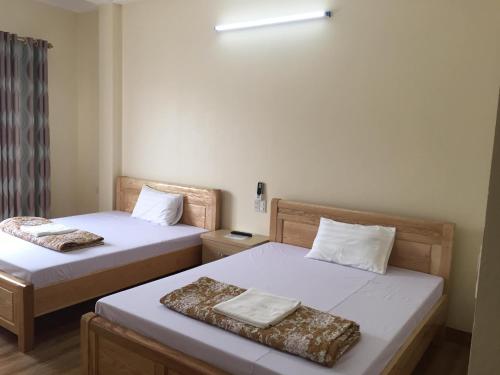 En eller flere senger på et rom på Việt Dũng Motel