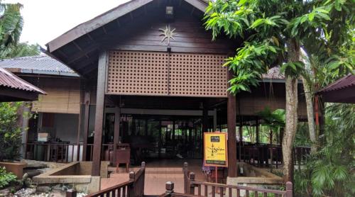 a building with a sign in front of it at Langkawi Lagoon Resort Water Chalet in Pantai Cenang