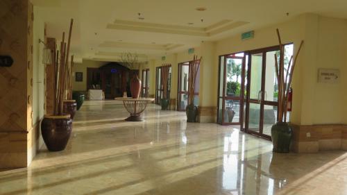 an empty hallway with vases in a building at Langkawi Lagoon Resort Water Chalet in Pantai Cenang