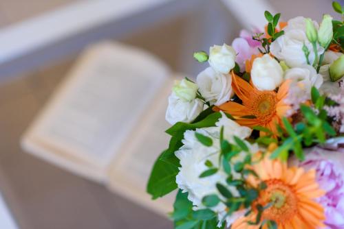 a bouquet of flowers sitting on top of a table at Tesori Dassia Villas in Dassia