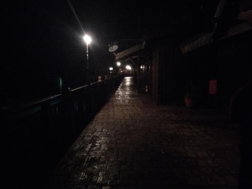 a dark street at night with a street light at Langkawi Lagoon Resort Water Chalet in Pantai Cenang