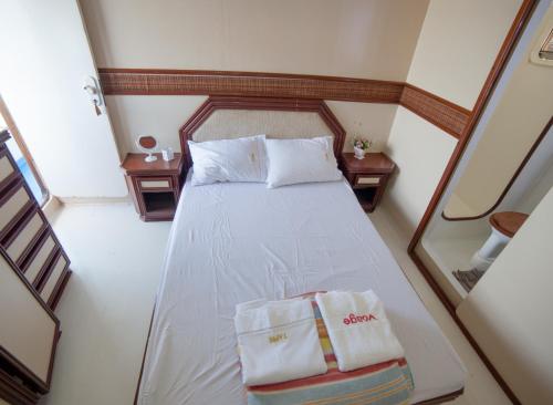 Voodi või voodid majutusasutuse Tapri - Hotel Flutuante toas