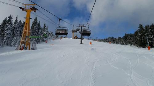 a ski lift on a snow covered ski slope at Springer-Apartment-1215 in Kurort Oberwiesenthal