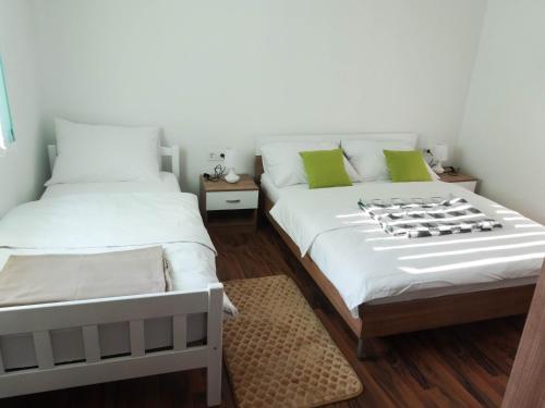 Postel nebo postele na pokoji v ubytování Apartman Sara vl. Franjo Klasić