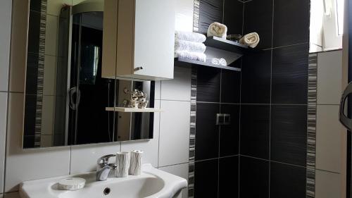 a bathroom with a sink and a mirror at Luxury house "Heart of Nature" Visoko in Visoko