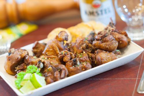 a plate of food sitting on a table at Matiz Multi Suites in Duque de Caxias