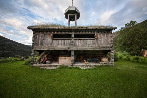 an old building with a tower on top of it at Kvaale Gard in Lom