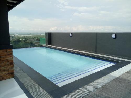 a swimming pool on top of a building at Cityscape Residences Unit 510 in Bacolod