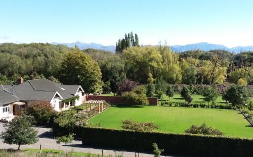 an aerial view of a house with a large lawn at Hurunui Homestead Bed and Breakfast in Hawarden