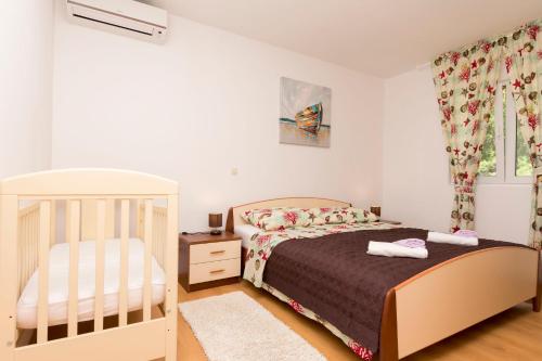 Posteľ alebo postele v izbe v ubytovaní Apartment Petea