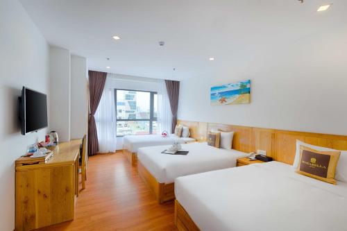 Giường trong phòng chung tại Rosabella Boutique Hotel