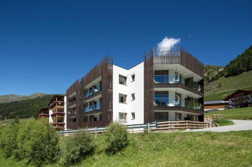 a building on the side of a hill at Langtaufererhof in Melago