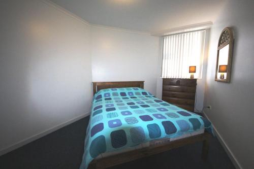 A bed or beds in a room at The Avenues Unit 1 at South West Rocks