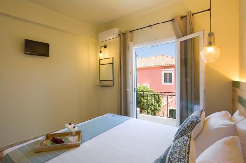 Ένα ή περισσότερα κρεβάτια σε δωμάτιο στο Villa Paxos