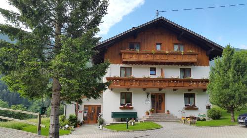 a building with a balcony on top of it at Gästehaus Ortner in Liesing