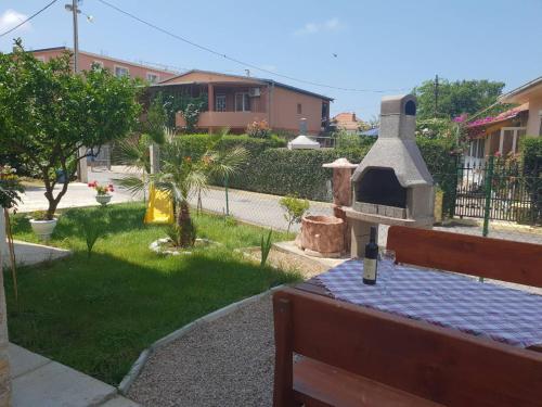 a view of a backyard with a pizza oven at De Lux Apartments Luka in Bar