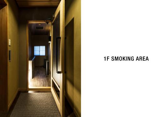 a hallway with an open door and a if smoking area at Nanzenji sando KIKUSUI in Kyoto