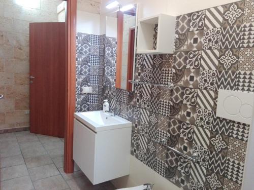 Ванна кімната в Appartamenti turistici Aprile Luca